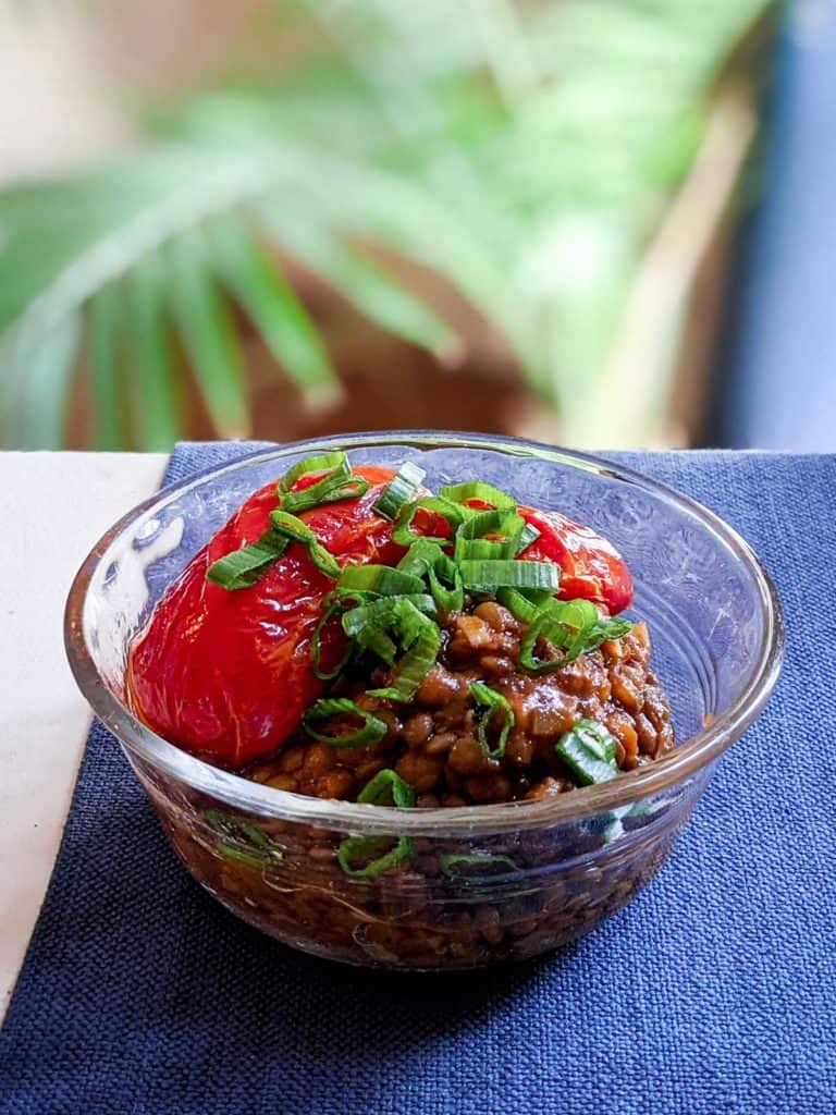 photo of a bowl of lentils with roasted tomatoes