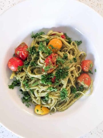 Overhead photo of a bowl of fettuccine with radish-greens pesto