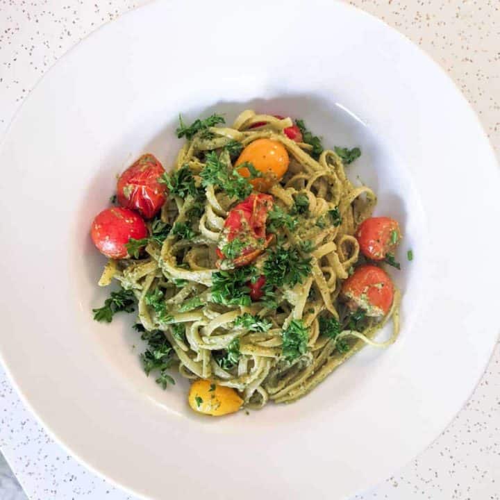 Overhead photo of a bowl of fettuccine with radish-greens pesto