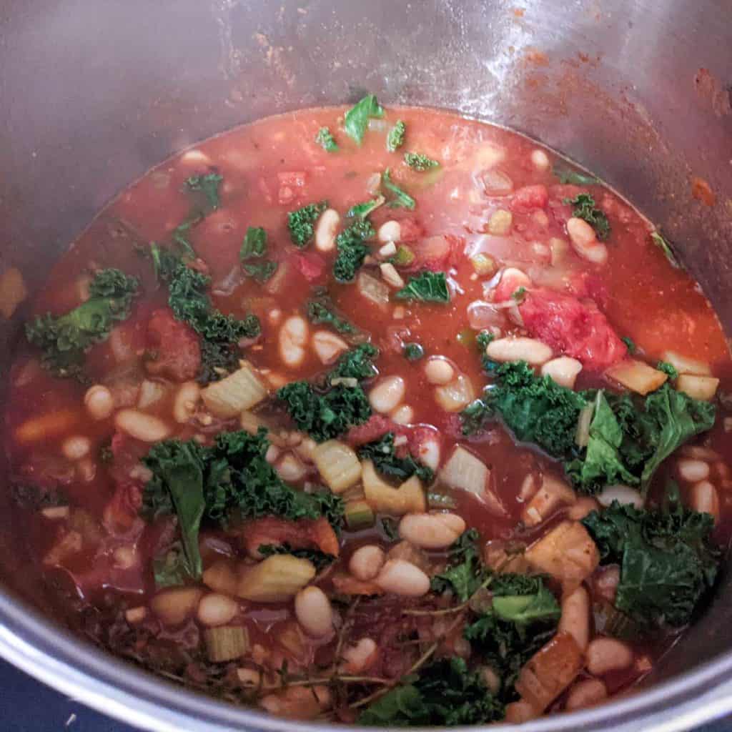 photo of tuscan white bean soup simmering