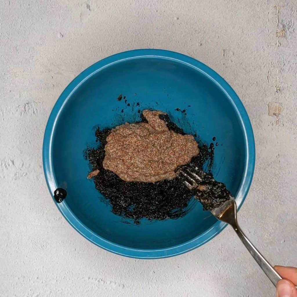 Photo of adding flax egg to granola wet ingredients