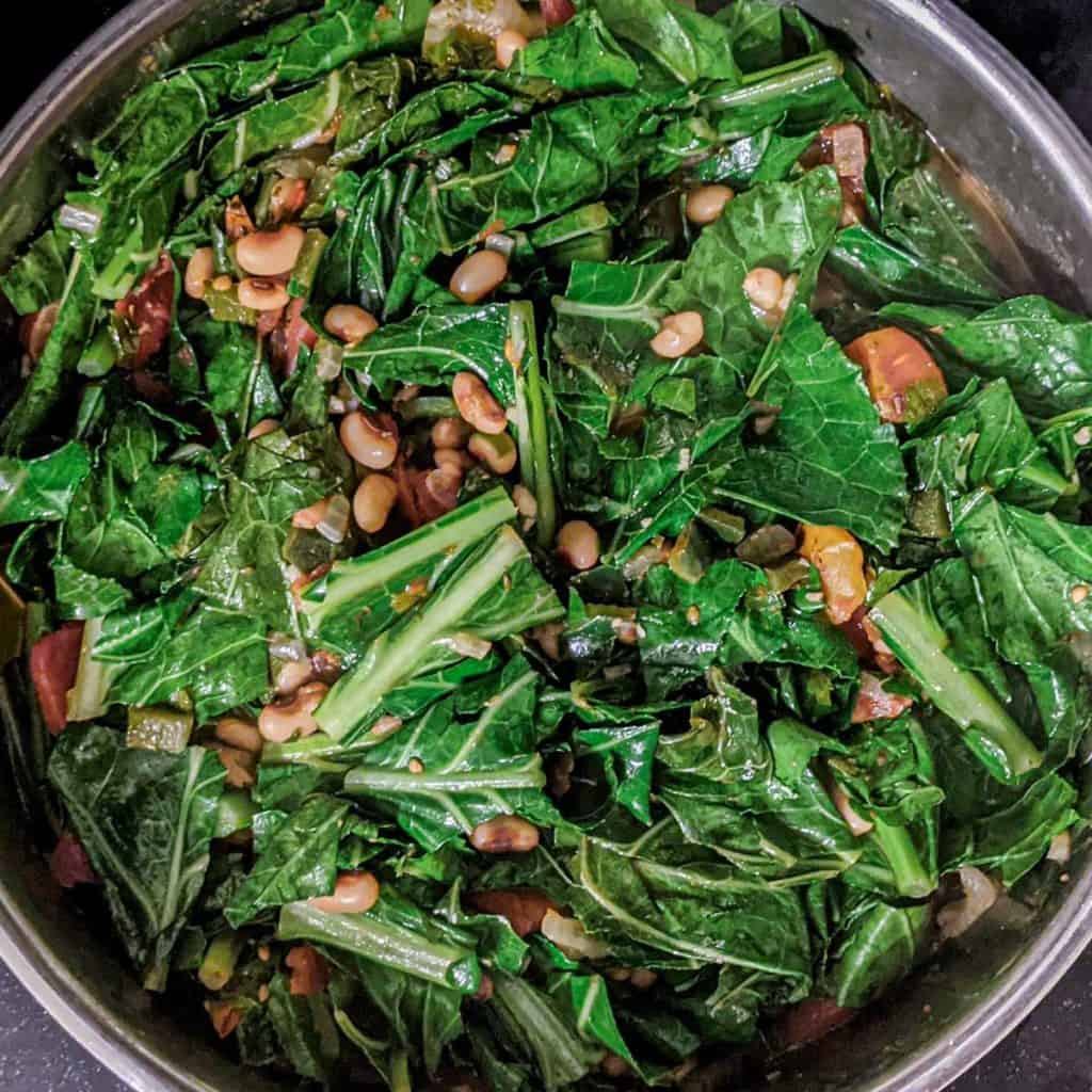 Photo of black eyed peas and collard greens cooking