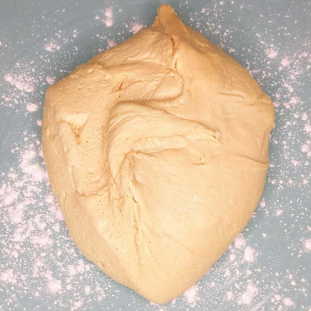 photo of challah dough on floured surface