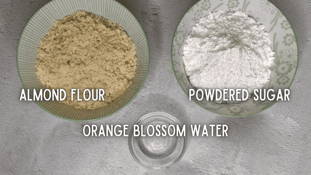 Photo of ingredients for orange blossom water marzipan: almond flour, powdered sugar, and orange blossom water