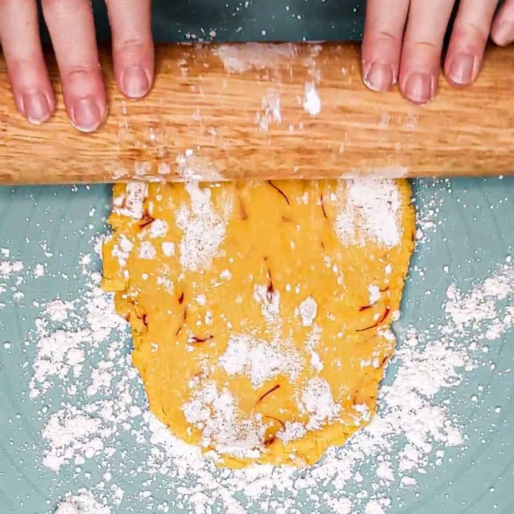 Overhead photo of a rolling pin and rolled out dough