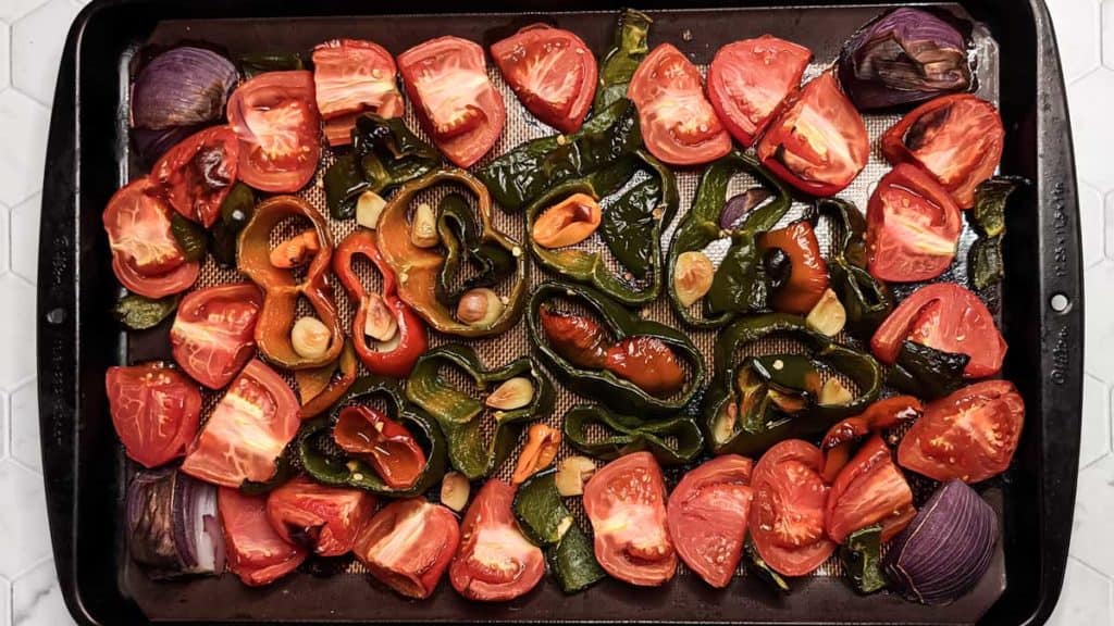 Overhead photo of a tray of roasted vegetables for vegan chili